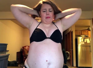 Fatty mother attempting bathing suit at
